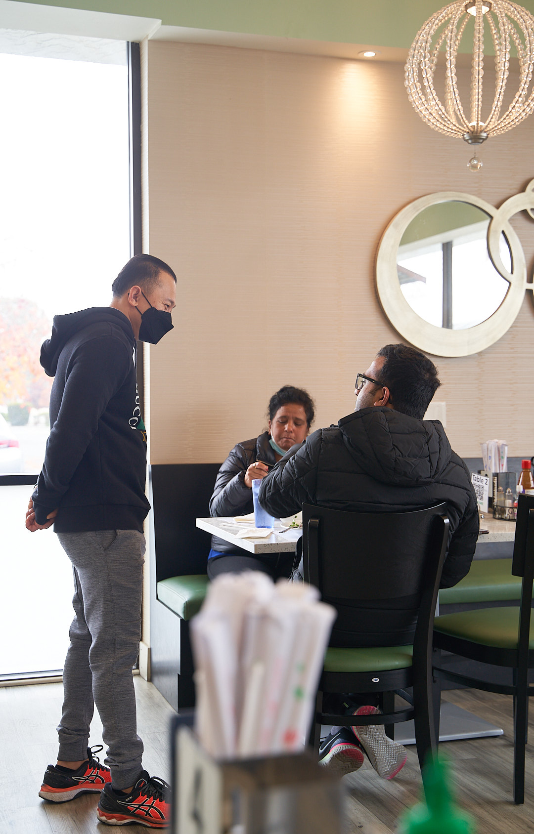 Customer enjoying Vietnamese cuisine at Pho 24